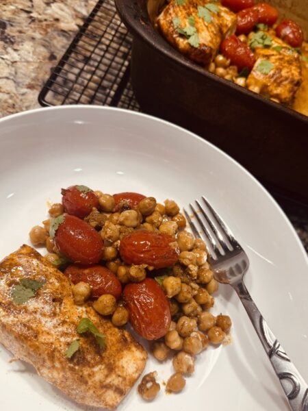 Savory halibut baked with chickpeas, garlic, and cherry tomatoes